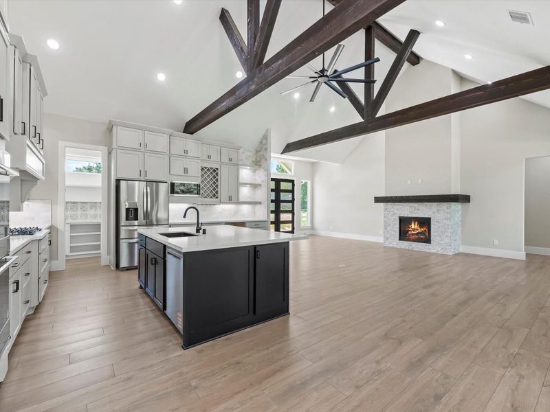 Kitchen and living area view from breakfast area. Kitchen and living area view from breakfast area.
