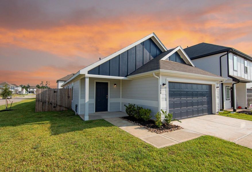 Front exterior of a new home in River's Edge, Conroe, TX, highlighting curb appeal (Image 2).