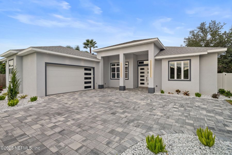 Front exterior of a new home in , Palm Coast, FL, highlighting curb appeal (Image 40). Front exterior of a new home in , Palm Coast, FL, highlighting curb appeal (Image 40).