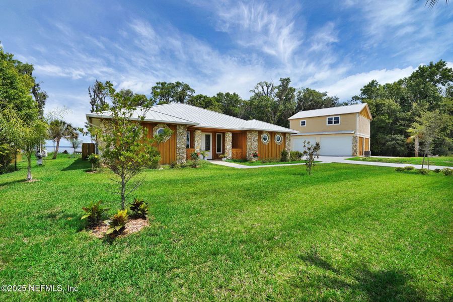 Front exterior of a new home in , East Palatka, FL, highlighting curb appeal (Image 43). Front exterior of a new home in , East Palatka, FL, highlighting curb appeal (Image 43).