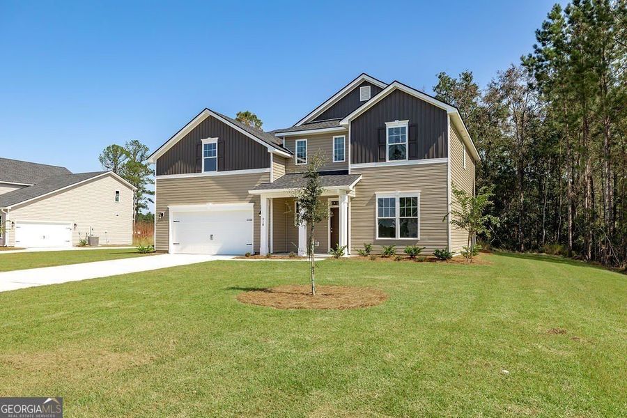 Front exterior of a new home in NorthShore on the St. Marys River, Kingsland, GA, highlighting curb appeal (Image 25).