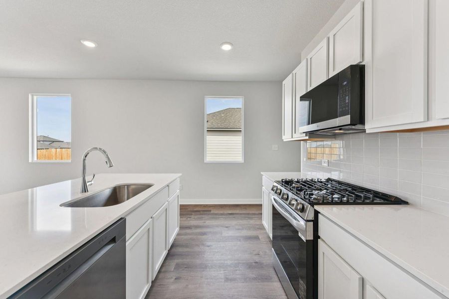 Furnished interior view inside a new home in Stallion Run, Buda (Image 7).