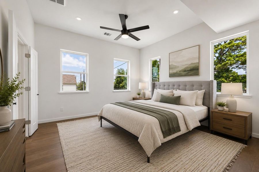 Primary bedroom featuring vaulted ceilings, abundant natural light, and a thoughtfully designed layout that creates a bright and relaxing retreat. Primary bedroom featuring vaulted ceilings, abundant natural light, and a thoughtfully designed layout that creates a bright and relaxing retreat.