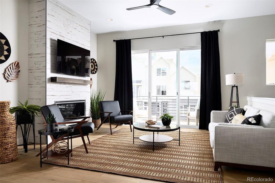 Living room with gas fireplace and grilling deck Living room with gas fireplace and grilling deck