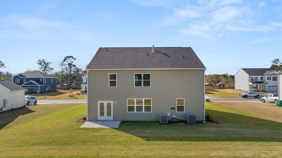 Front exterior of a new home in Southwind Village, Evans, GA, highlighting curb appeal (Image 21).