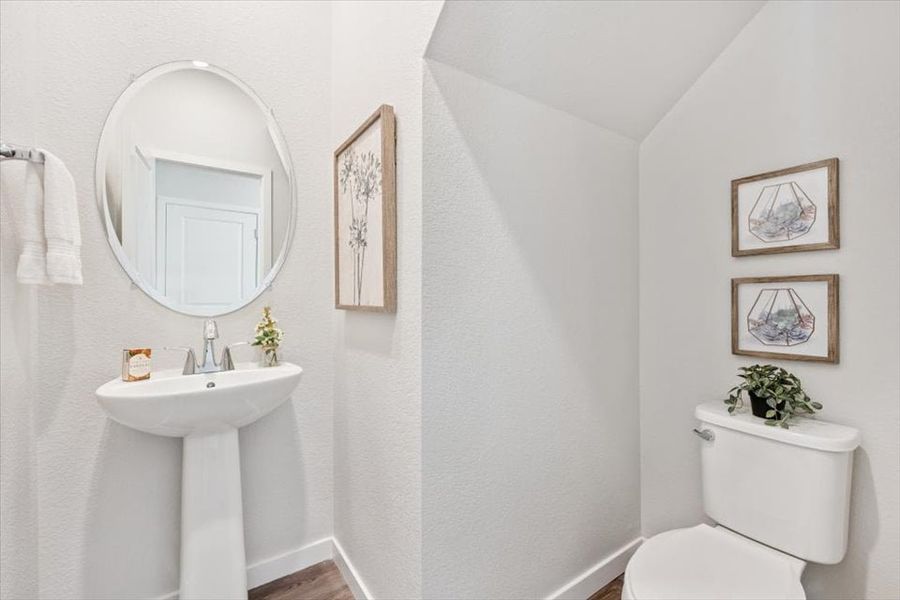 A bathroom with a sink and a mirror. A bathroom with a sink and a mirror.