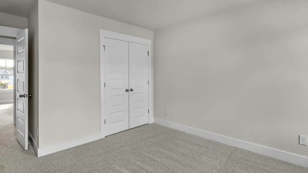 Representative unfurnished interior of a home built from the Forrester by D.R. Horton in The Highlands at Cedar Hill Landing, Navassa (Image 32).