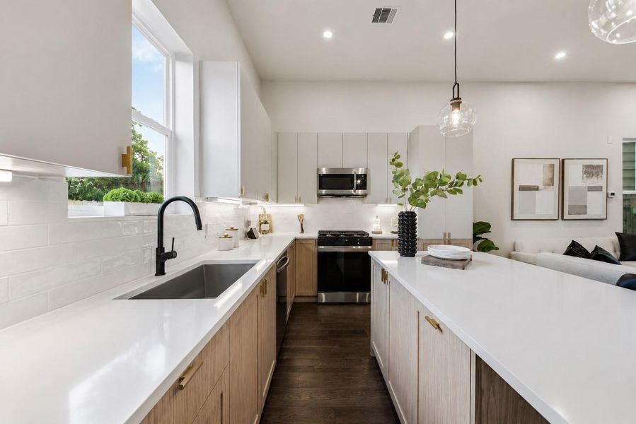 Gourmet kitchen with quartz countertops and spacious center island Gourmet kitchen with quartz countertops and spacious center island