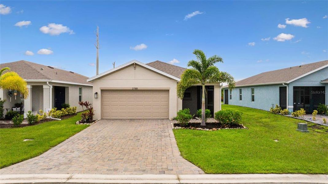 Front exterior of a new home in , North Fort Myers, FL, highlighting curb appeal (Image 24).