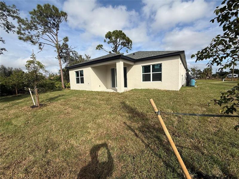 Exterior details and patio area of a home in , North Port (Image 25).