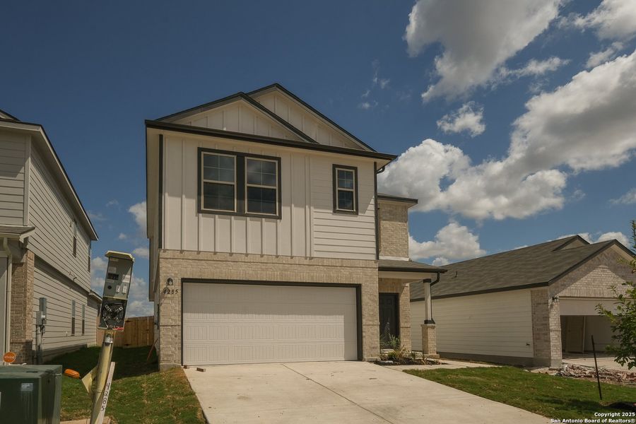 Front exterior of a new home in Park Place, New Braunfels, TX, highlighting curb appeal (Image 1).