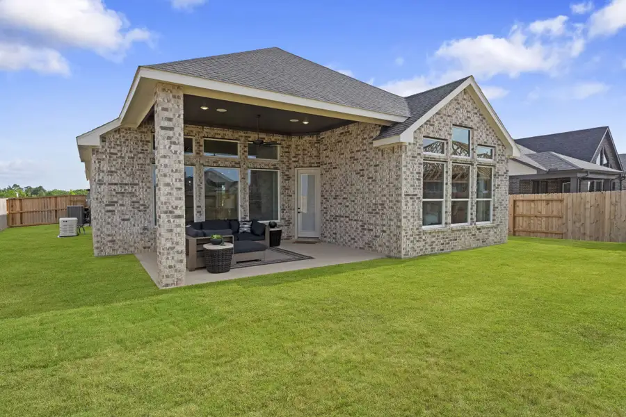 Exterior details and patio area of a home in Grange, Katy (Image 3).