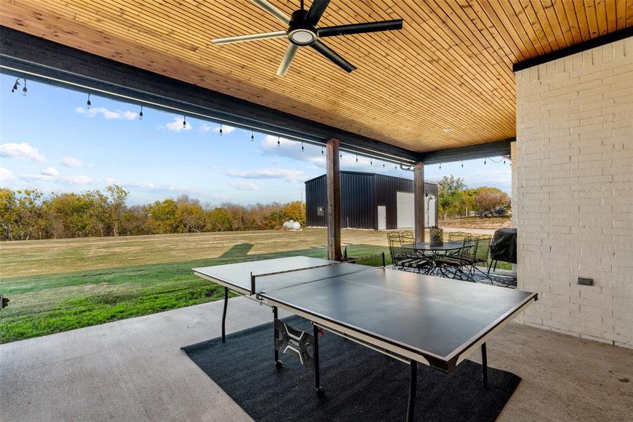 View of patio featuring ceiling fan