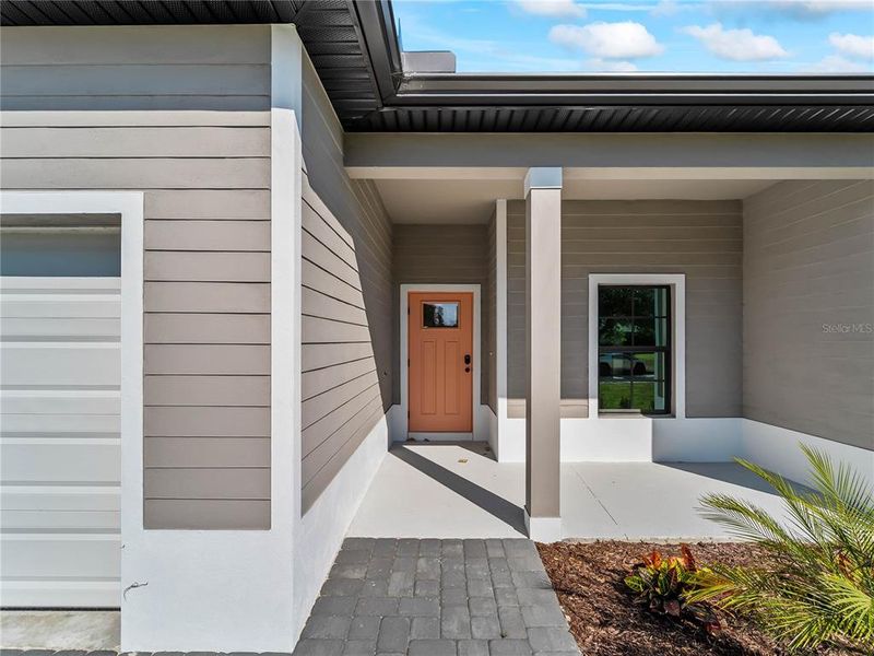 Exterior details and patio area of a home in , North Port (Image 29).