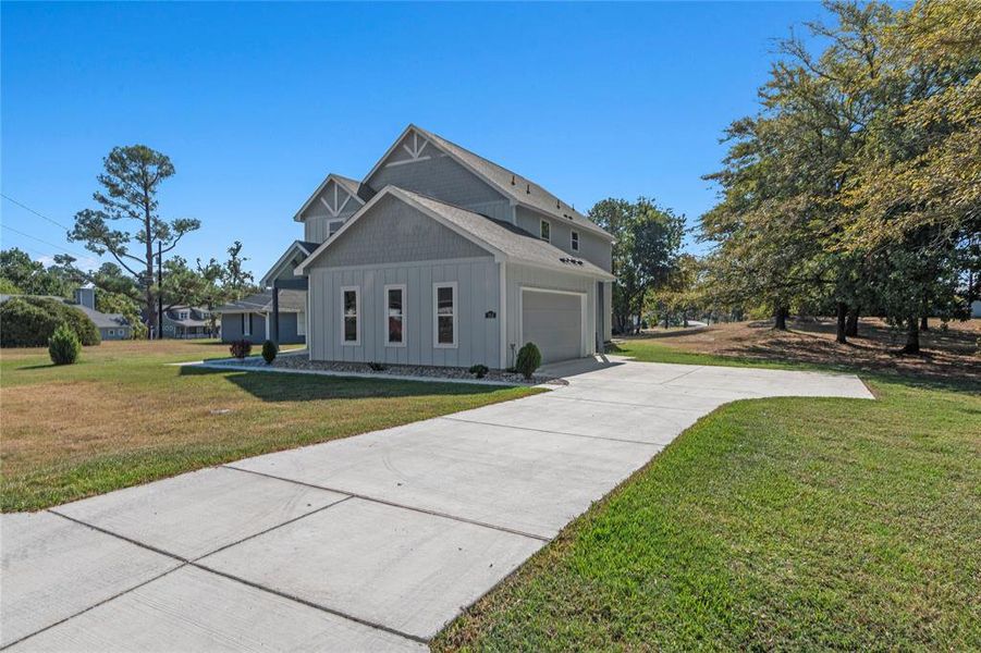 Front exterior of a new home in , Tool, TX, highlighting curb appeal (Image 2). Front exterior of a new home in , Tool, TX, highlighting curb appeal (Image 2).
