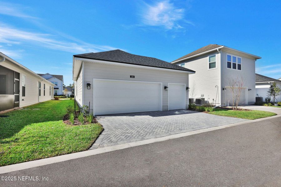 Front exterior of a new home in , Ponte Vedra, FL, highlighting curb appeal (Image 24).