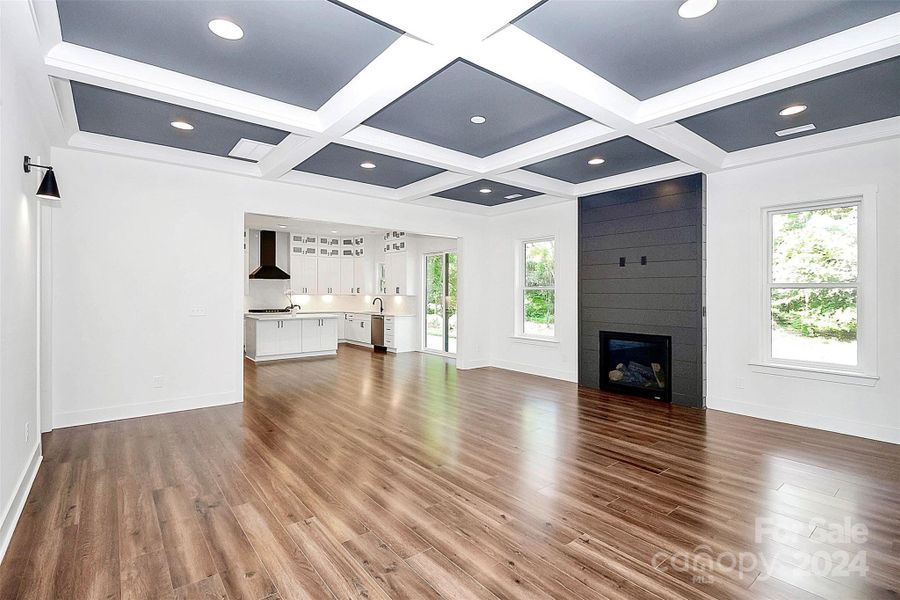 Primary bathroom with 2 vanities, floor to ceiling tile in shower, linen closet & water closet.