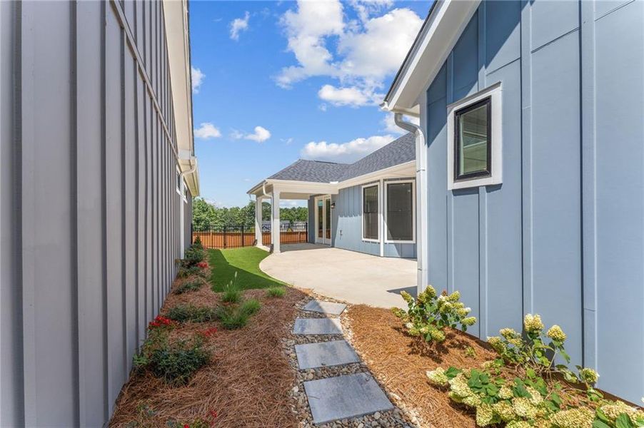 Exterior details and patio area of a home in The Courtyards at Redbud Lane, Canton (Image 18).