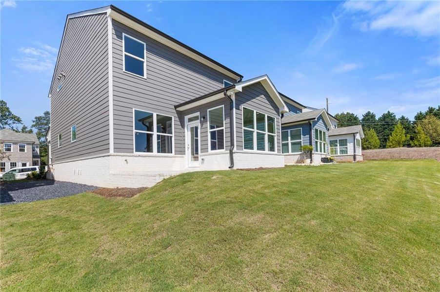 Front exterior of a new home in , Dacula, GA, highlighting curb appeal (Image 17).