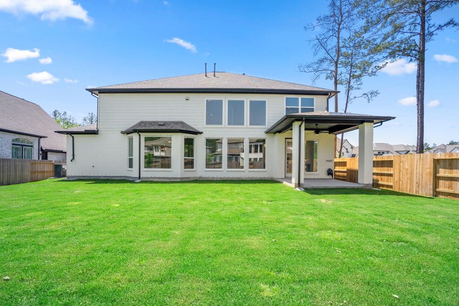 Exterior details and patio area of a home in Artavia 70′ Lots, Conroe (Image 3).