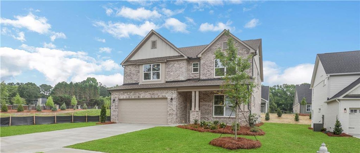 Front exterior of a new home in , Loganville, GA, highlighting curb appeal (Image 22).