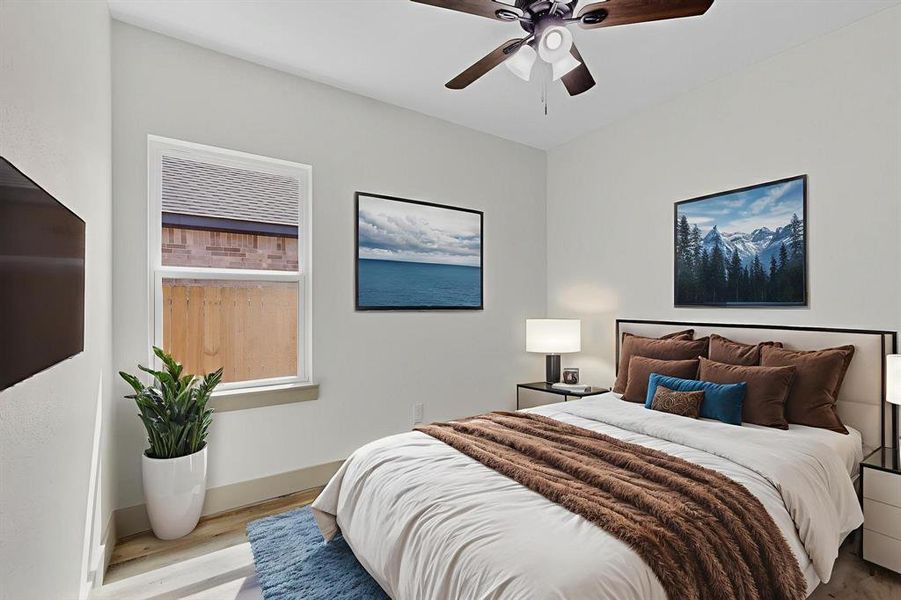 Bedroom featuring wood finished floors and a ceiling fan
