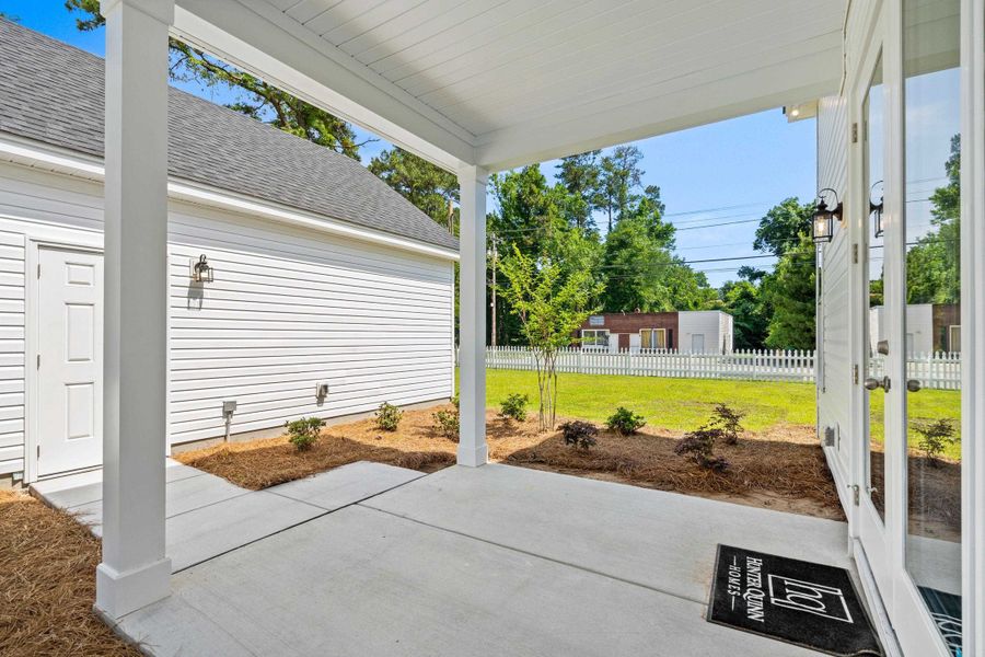Exterior details and patio area of a home in Downtown Loris Homes, Loris (Image 29).