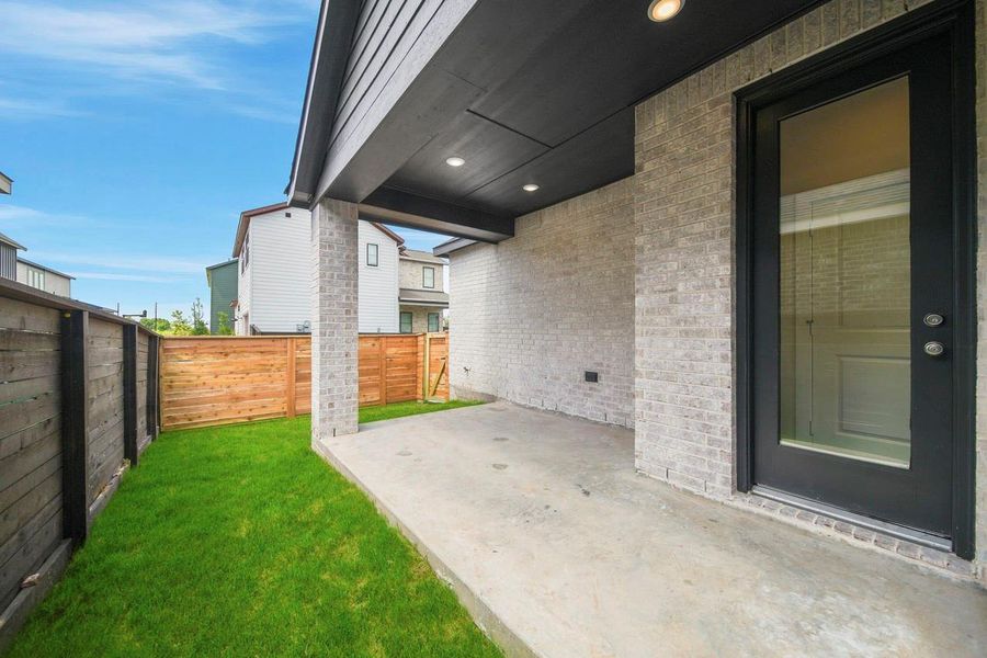 A covered patio offers a shaded outdoor retreat, perfect for relaxing, entertaining and enjoying fresh air year-round.