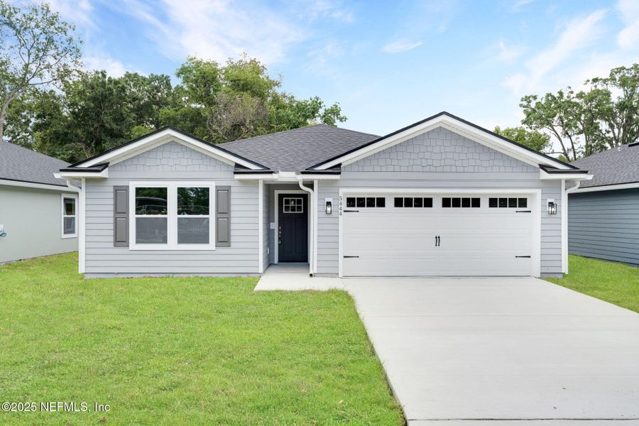 Front exterior of a new home in , Jacksonville, FL, highlighting curb appeal (Image 1). Front exterior of a new home in , Jacksonville, FL, highlighting curb appeal (Image 1).