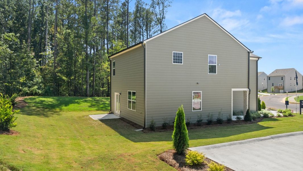 Representative exterior photo of a completed home built from the AISLE by D.R. Horton in Pointe Park, Union City, GA (Image 21).