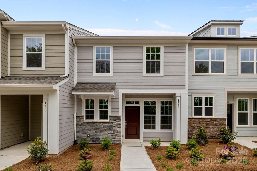 Front exterior of a new home in Greenway Overlook, Charlotte, NC, highlighting curb appeal (Image 1). Front exterior of a new home in Greenway Overlook, Charlotte, NC, highlighting curb appeal (Image 1).