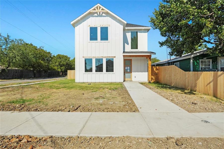Modern inspired farmhouse featuring board and batten siding Modern inspired farmhouse featuring board and batten siding