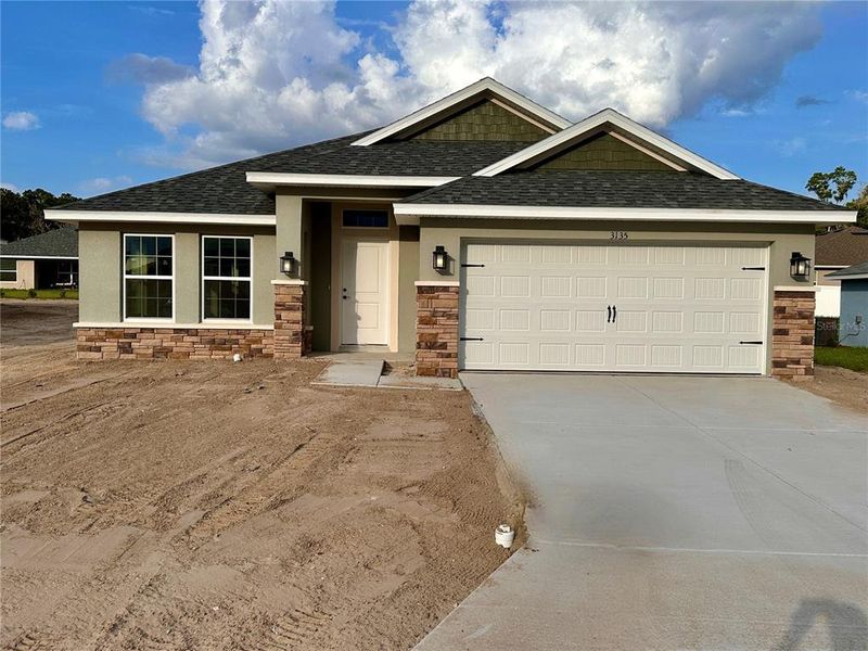 Front exterior of a new home in , Ocala, FL, highlighting curb appeal (Image 1). Front exterior of a new home in , Ocala, FL, highlighting curb appeal (Image 1).