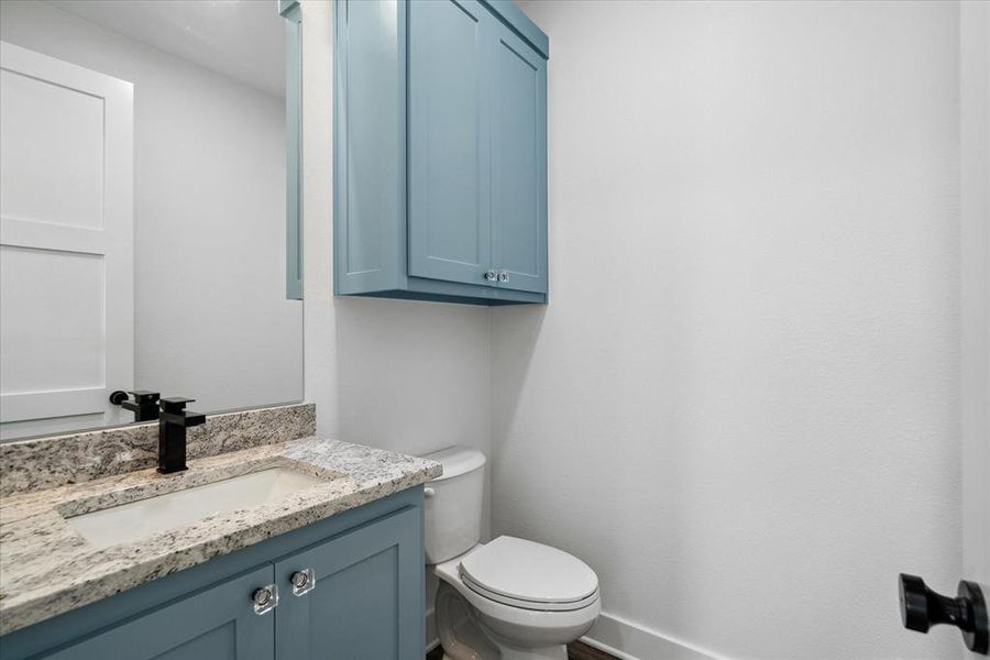 Bathroom with vanity and toilet