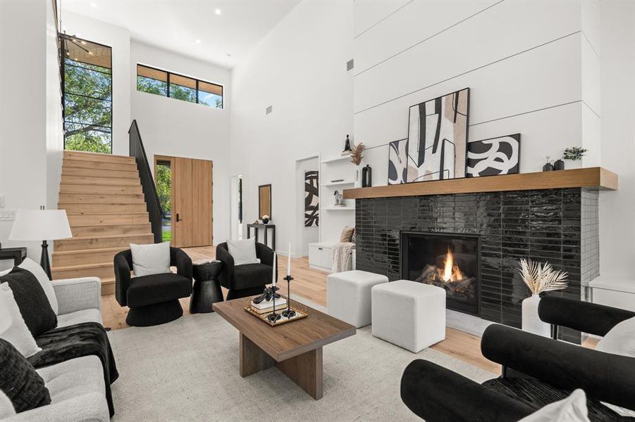 Soaring 20+ foot ceilings and oversized windows flood the space with natural light.