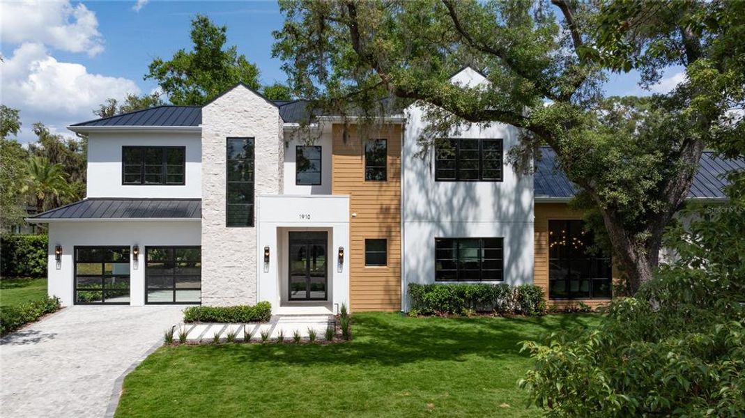 Front exterior of a new home in , Winter Park, FL, highlighting curb appeal (Image 22).