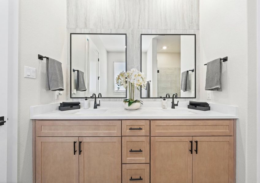 The master bathroom has a sprawling dual-sink vanity.