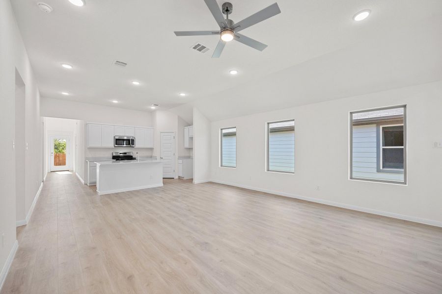 Living and Dining Area in the Cypress home plan by Trophy Signature Homes - REPRESENTATIVE PHOTO