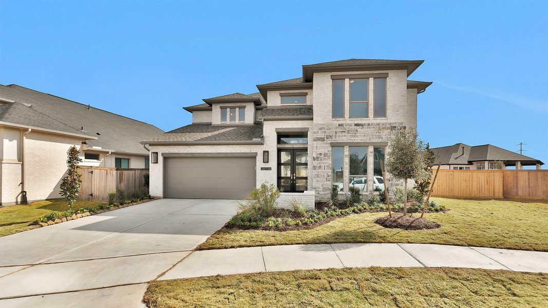 Front exterior of a new home in Bridgeland, Cypress, TX, highlighting curb appeal (Image 2).