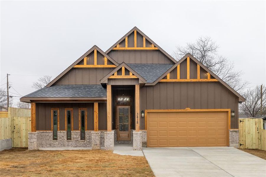 View of front of property featuring a garage