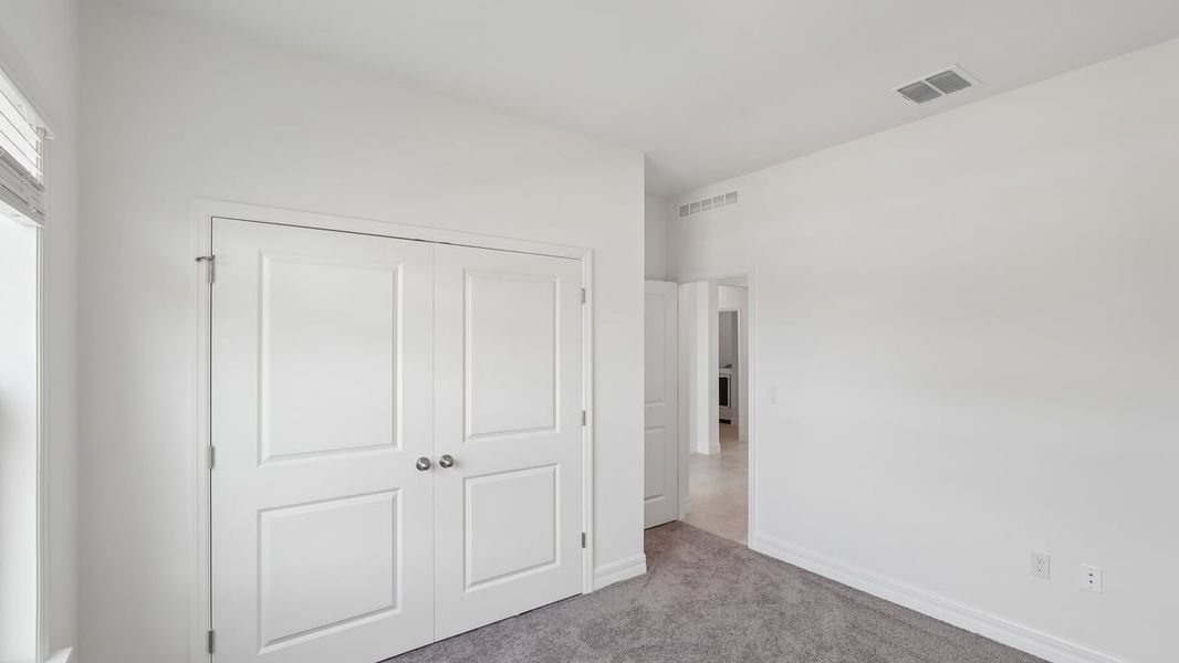 Spacious, unfurnished interior of a new home in Heritage Station, Punta Gorda (Image 42).