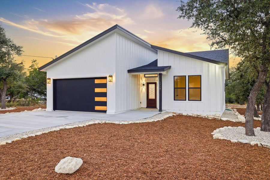 Front exterior of a new home in , Fischer, TX, highlighting curb appeal (Image 24). Front exterior of a new home in , Fischer, TX, highlighting curb appeal (Image 24).