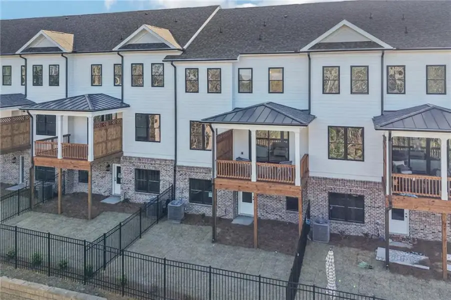 Front exterior of a new home in Millcroft, Buford, GA, highlighting curb appeal (Image 24).