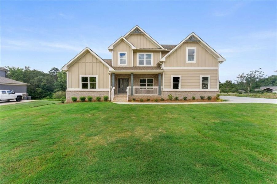 Front exterior of a new home in Steeplechase, Hoschton, GA, highlighting curb appeal (Image 2).