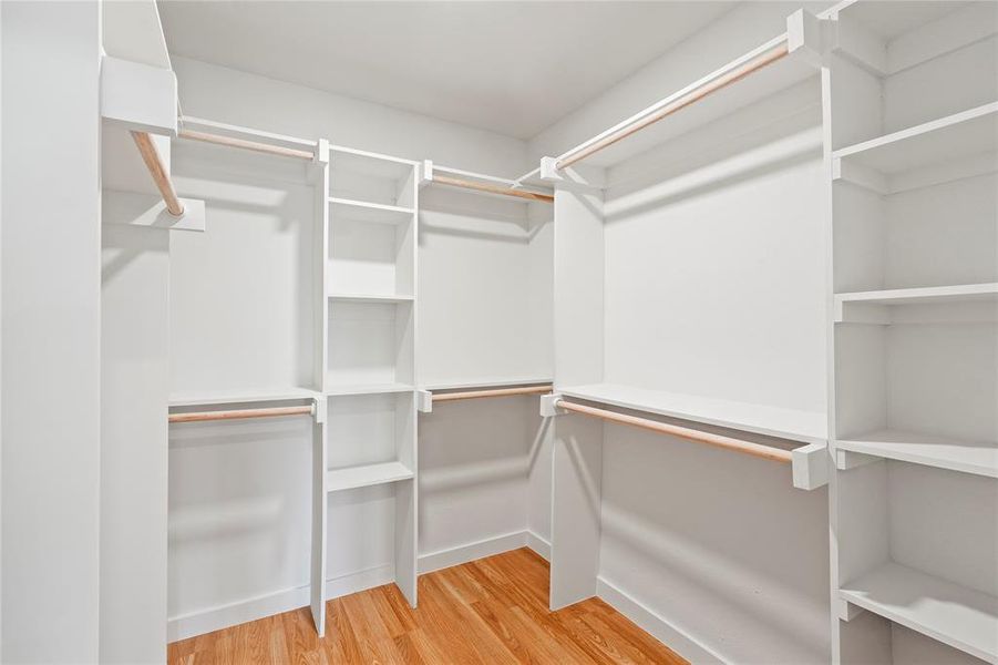 Walk in closet featuring hardwood / wood-style flooring