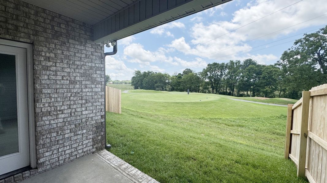 Exterior details and patio area of a home in The Greens at Legacy Townhomes, Springfield (Image 3).