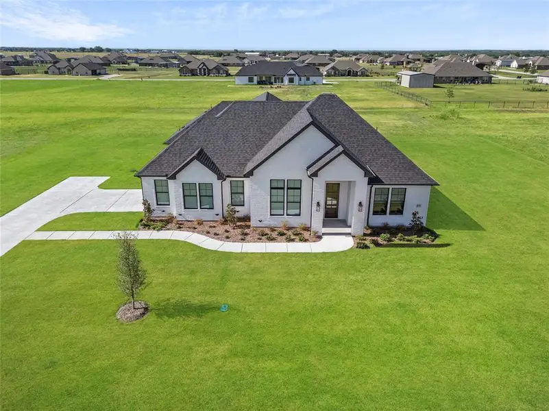 View of front of property featuring a front lawn