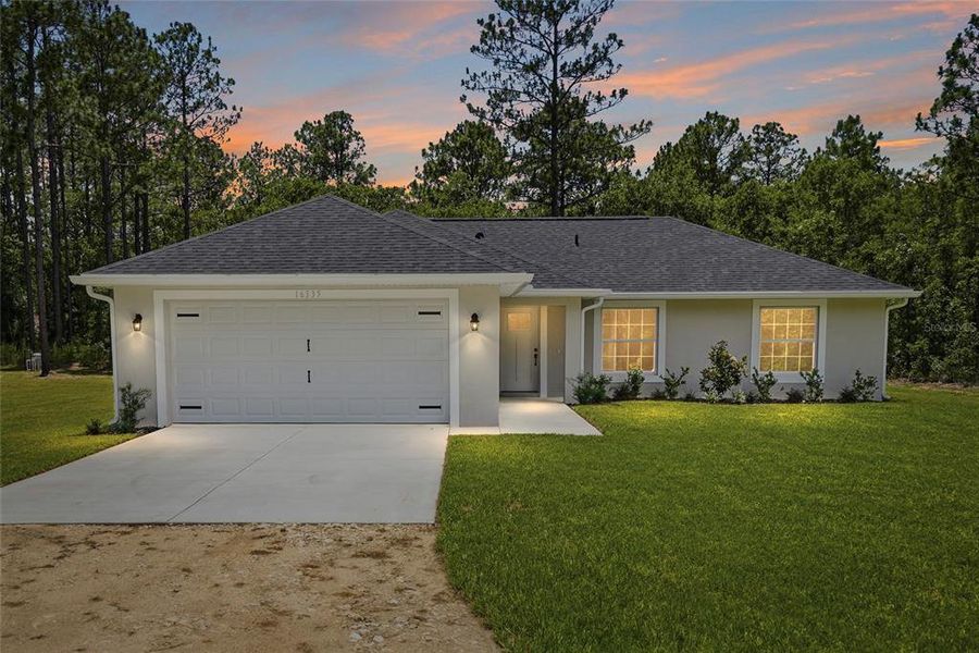Front exterior of a new home in , Weeki Wachee, FL, highlighting curb appeal (Image 27). Front exterior of a new home in , Weeki Wachee, FL, highlighting curb appeal (Image 27).