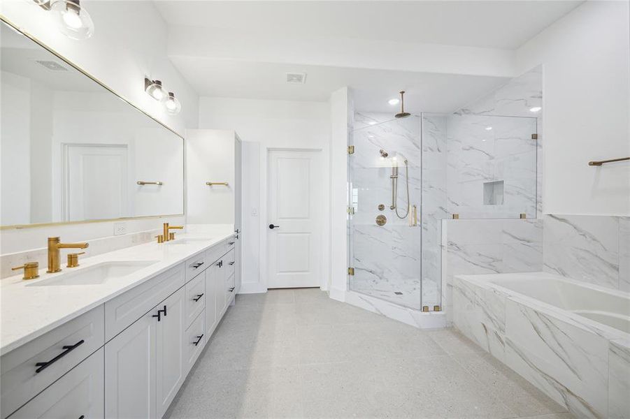 Primary bathroom double sink and a gorgeous freestanding soaking tub. Tub in the photo is from a different home.