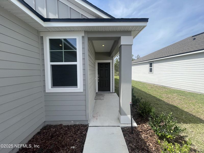 Exterior details and patio area of a home in Palm Series at Seminole Palms, Palm Coast (Image 28).